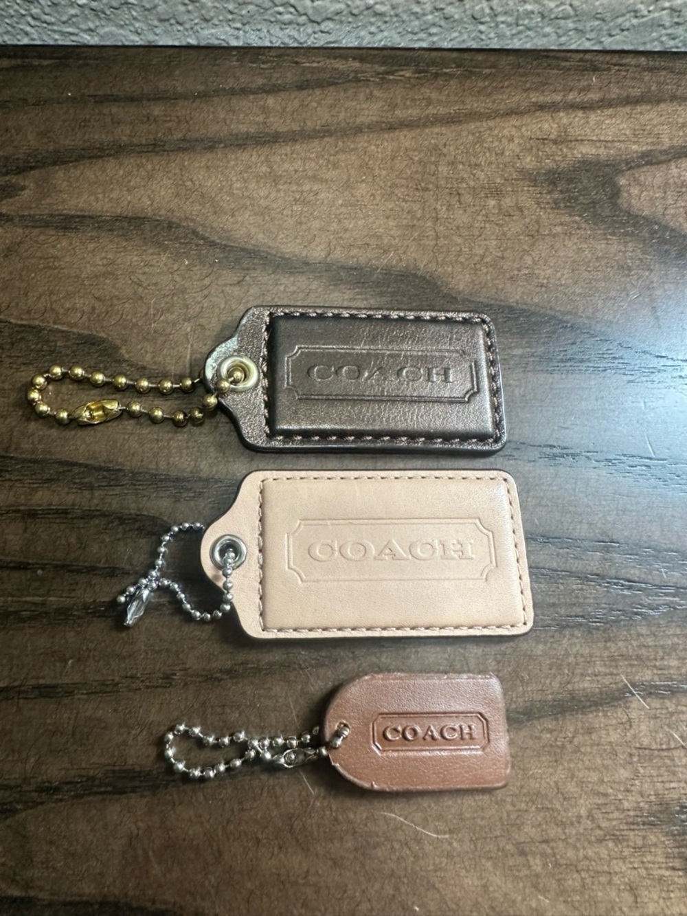 Coach Leather Hangtag Trio in Metallic Bronze, Blush, and Brown